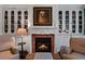 Inviting living room featuring a fireplace with white mantel and built-in bookshelves at 2660 Peachtree Rd # 6A, Atlanta, GA 30305