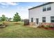 View of backyard featuring a well-maintained lawn, privacy fence, and stone patio at 3848 Hester St, Duluth, GA 30097