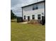 Backyard featuring green grass, a dark fence and stone elevation at 3848 Hester St, Duluth, GA 30097