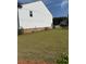 Exterior of home with stone elevation, and large, green, grassy backyard at 3848 Hester St, Duluth, GA 30097