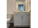 Bathroom featuring modern vanity, neutral tones, and ample storage space at 3848 Hester St, Duluth, GA 30097