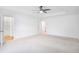 A carpeted bedroom with multiple doorways, one leading to a bathroom and another to a hallway at 3848 Hester St, Duluth, GA 30097