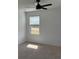Bedroom featuring a ceiling fan and a window offering natural light at 3848 Hester St, Duluth, GA 30097