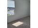 Bright bedroom with a window allowing natural light and views of the street at 3848 Hester St, Duluth, GA 30097