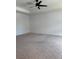 Spacious bedroom featuring carpet flooring, ceiling fan, and neutral tones creating a relaxing atmosphere at 3848 Hester St, Duluth, GA 30097