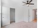 Bedroom with a closet, an en-suite bathroom, carpeted floors and ceiling fan at 3848 Hester St, Duluth, GA 30097