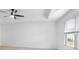 The bedroom boasts a large window, a ceiling fan, and a clean, minimalist aesthetic at 3848 Hester St, Duluth, GA 30097
