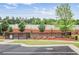 Fenced community dog park area with green space and pet waste station at 3848 Hester St, Duluth, GA 30097