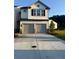 Charming two-story home with a two-car garage and neutral color palette at 3848 Hester St, Duluth, GA 30097