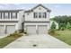 Charming two-story townhouse with a two-car garage and well-maintained landscaping at 3848 Hester St, Duluth, GA 30097