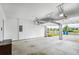 Spacious garage features an open garage door and concrete floors at 3848 Hester St, Duluth, GA 30097