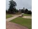 Community greenspace with grassy area, brick walkways and manicured lawn at 3848 Hester St, Duluth, GA 30097