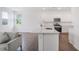 Modern kitchen with white cabinets, stainless steel appliances, and a center island at 3848 Hester St, Duluth, GA 30097