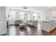 Open concept living space with a fireplace and a view of the kitchen island at 3848 Hester St, Duluth, GA 30097