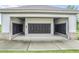 A secured, covered cluster mailbox setup on a concrete pad and manicured grounds at 3848 Hester St, Duluth, GA 30097