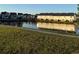 Picturesque pond view with ducks and charming houses reflected in the water at 3848 Hester St, Duluth, GA 30097