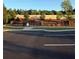 Community pool entrance set in a parking area, surrounded by an iron fence at 3848 Hester St, Duluth, GA 30097
