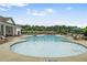 Large community pool with lounge seating and shade umbrellas at 3848 Hester St, Duluth, GA 30097