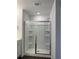 Modern shower with a sliding glass door and sleek fixtures, offering a spa-like experience at 3848 Hester St, Duluth, GA 30097