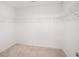 A walk-in closet features carpet, built-in wire shelving for storage and a blank canvas for organization at 3848 Hester St, Duluth, GA 30097