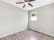 Bedroom featuring neutral wall paint, modern ceiling fan and wood-look flooring at 4289 Post Rd, Winston, GA 30187