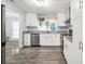 Modern kitchen with white cabinets, stainless steel appliances, and granite countertops at 4289 Post Rd, Winston, GA 30187