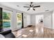 Bright living room featuring hardwood floors, large windows and neutral wall paint at 4289 Post Rd, Winston, GA 30187
