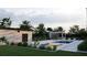 Serene backyard with a pool, outdoor kitchen, and sunken fire pit area, perfect for entertaining at 5370 Greenleaf Sw Dr, Mableton, GA 30126