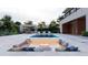 Stunning backyard oasis with a pool, sunken fire pit lounge area, and manicured landscaping at 5370 Greenleaf Sw Dr, Mableton, GA 30126