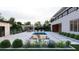 A modern home with a luxurious backyard featuring a swimming pool, sunken lounge, and lush landscaping at 5370 Greenleaf Sw Dr, Mableton, GA 30126