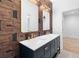 Contemporary bathroom featuring double vanity, gold fixtures and stylish wallpaper at 5370 Greenleaf Sw Dr, Mableton, GA 30126
