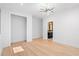 Bright bedroom featuring hardwood floors, modern light fixture and bathroom access at 5370 Greenleaf Sw Dr, Mableton, GA 30126