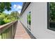 Long modern wood deck features a white exterior, a wood railing, and views of surrounding greenery at 5370 Greenleaf Sw Dr, Mableton, GA 30126