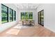Bright dining room with coffered ceilings, natural light and views of the landscaped backyard at 5370 Greenleaf Sw Dr, Mableton, GA 30126