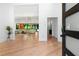Bright, open foyer with hardwood floors, a view into the living area, and modern design elements at 5370 Greenleaf Sw Dr, Mableton, GA 30126