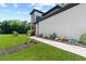 Landscaped walkway leading to a modern home with a combination of siding and carefully placed decorative plants at 5370 Greenleaf Sw Dr, Mableton, GA 30126