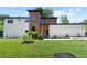 Stunning modern home with a mix of wood and white siding, complemented by lush green landscaping at 5370 Greenleaf Sw Dr, Mableton, GA 30126