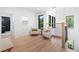 Bright hallway featuring a railing and large window with views of the backyard at 5370 Greenleaf Sw Dr, Mableton, GA 30126