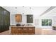 Kitchen featuring an island with seating, striking green cabinetry, and modern pendant lighting at 5370 Greenleaf Sw Dr, Mableton, GA 30126