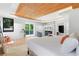 Main bedroom features a marble fireplace, wood floors, and access to a private outdoor deck at 5370 Greenleaf Sw Dr, Mableton, GA 30126
