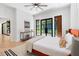 Bright bedroom with a ceiling fan, natural light, and an access door to the backyard at 5370 Greenleaf Sw Dr, Mableton, GA 30126