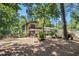 Expansive backyard with mature trees, partially screened porch, pool, and fenced perimeter for outdoor enjoyment at 5491 Valley Brook Road Southeast Se Rd, Mableton, GA 30126