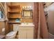 Bathroom with ornate mirror, wall shelves and natural light at 5491 Valley Brook Road Southeast Se Rd, Mableton, GA 30126