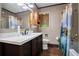 Classic bathroom with a dark vanity, wood floors, and a decorative shower curtain at 5491 Valley Brook Road Southeast Se Rd, Mableton, GA 30126