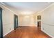 Spacious dining room with hardwood floors, a chandelier, and large windows providing natural light at 5491 Valley Brook Road Southeast Se Rd, Mableton, GA 30126