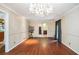 Light-filled dining room with hardwood floors, chandelier, and neutral wall colors, ready for entertaining at 5491 Valley Brook Road Southeast Se Rd, Mableton, GA 30126