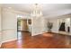 Dining room featuring hardwood floors, a chandelier, and a view to the staircase and kitchen at 5491 Valley Brook Road Southeast Se Rd, Mableton, GA 30126