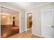 Hallway features tiled floors and a view into the living and kitchen areas, accented with a white trim at 5491 Valley Brook Road Southeast Se Rd, Mableton, GA 30126
