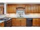 Kitchen features stone countertops, stainless steel appliances, and tile backsplash at 5491 Valley Brook Road Southeast Se Rd, Mableton, GA 30126