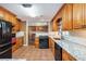 Kitchen features stone countertops, stainless steel appliances, and tile backsplash at 5491 Valley Brook Road Southeast Se Rd, Mableton, GA 30126